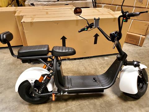 A 2021 Citycoco 2000W electric scooter featuring a sleek design with a comfortable seat and handlebars equipped with controls and mirrors
