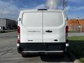 White 2017 Ford Transit 250 van viewed from the rear with a smooth surface and large taillights