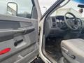 Interior view of a 2008 Dodge Ram 5500 showing the driver's side door dashboard and steering wheel with gray upholstery and control panel