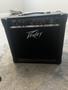 A Peavey Rage 158 amplifier with knobs and control panel on top designed for electric guitars