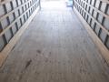 Interior view of the cargo space of a 2014 International Durastar with a wooden floor and wooden side panels