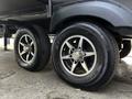Close-up of two black tires on a 2021 Grand Design Recreational 311BHS with silver alloy rims and "Endurance" branding on the sidewall