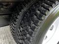 A close-up view of a tire from a 2018 Isuzu NRR showcasing its tread pattern and surface detail