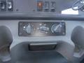 Dashboard controls of a 2005 Freightliner M2 106 Medium Duty featuring various knobs for climate and ventilation settings