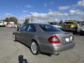 2007 Mercedes-Benz E-Class in silver with a sleek design and alloy wheels parked in an outdoor area