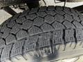 Close-up of a treaded tire from a 2017 Mercedes-Benz Sprinter showing detailed patterns and grooves designed for traction on various surfaces
