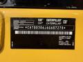 A 2022 Caterpillar 306CR equipment nameplate showing the model number build date and product identification number