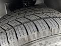 A close-up view of a treaded tire from a 2023 Mercedes-Benz Sprinter showcasing the detailed rubber patterns and grooves