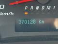 A digital odometer display showing a reading of 370128 kilometers on a 2019 Chevrolet Express