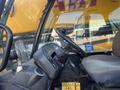 Interior view of a 2013 JCB 510-56 Loadall showing the steering wheel control panel and seat