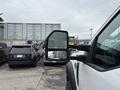 A 2018 Ford F-550 is prominently displayed with its large side mirror visible in the foreground