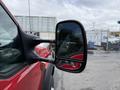 A 2007 Ford F-550 with a focus on the side mirror showcasing its design and structure