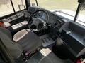 Interior view of a 2022 Blue Bird BB Conventional school bus featuring a driver's seat steering wheel control panel and dashboard instruments