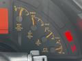 Dashboard of a 1992 Chevrolet Corvette showing various gauges for oil pressure oil temperature temperature and voltage