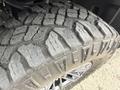 Close-up of a rugged tire tread on a 2019 Ford F-150 showcasing deep grooves and aggressive patterns designed for off-road traction
