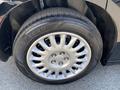Close-up of a silver wheel with a five-spoke design featuring a Goodyear tire on a 2019 Dodge Charger