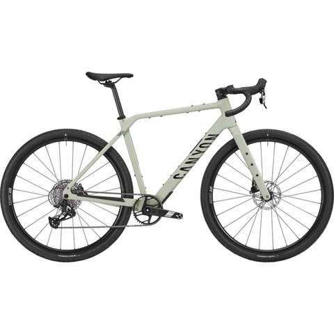 2026 Canyon Grizl CF 6 Carbon Adventure Gravel Road Bike with a light green frame disc brakes and wide tires designed for off-road and gravel riding