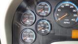 The dashboard of a 2012 International Work Star 7400 displaying gauges for engine oil temperature water temperature transmission temperature oil pressure and RPM