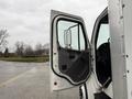 A 2018 Freightliner M2 106 with the driver's door open showcasing the interior and driver's seat