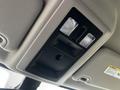 Ceiling console of a 2022 RAM 1500 Classic featuring two interior lights and a storage compartment