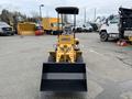 2024 AGT Industrial KRW23 Mini Loader with a black front bucket and a yellow chassis facing forward