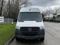 Front view of a white 2021 Mercedes-Benz Sprinter van with a black grille featuring the Mercedes logo