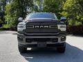 Front view of a 2022 RAM 3500 showcasing its large grille with the RAM logo and bold headlights