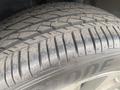 Close-up of a tire from a 2018 Buick Encore showing tread patterns and wear on the surface