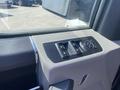 Close-up of the control panel for window and mirror adjustments inside a 2017 Ford F-150