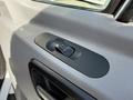 A power window control switch installed on the door panel of a 2016 Mercedes-Benz Sprinter