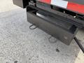 Close-up of the rear hitch of a 2011 International 4300 displaying two hooks for securing loads