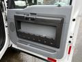 The image shows the interior door panel of a 2016 Ford F-550 Super Duty with a gray plastic design featuring a built-in handle and storage compartment