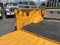 The image shows the yellow truck bed of a 2017 Ford F-250 SD with a textured rubber mat and visible wheel well