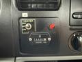Close-up of the control panel in a 2006 Ford F-450 showing the heater settings and hour meter