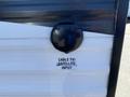A black cable TV and satellite input port on the side of a 2016 Jayco 265RLSW travel trailer with a white exterior