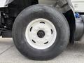 Close-up of a Goodyear tire mounted on a 2016 International 7600 truck showing the wheel hub and textured tread pattern