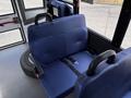 Interior view of a blue upholstered bench seat with seatbelt designed for a 2020 Chevrolet Express