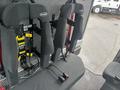 A 2006 E-One Typhoon featuring black high-back seats with yellow safety harnesses secured to the frame