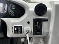 Interior view of a 2015 Spartan School Bus showing the dashboard with gauges gear shift and ignition key slot