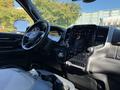 Interior view of a 2021 RAM 3500 showcasing the dashboard and touchscreen display with various controls and dials