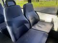 Interior seating of a 2018 Chevrolet Express with blue patterned upholstery