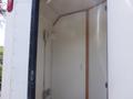 Interior view of a 2004 Royal 18 Foot Office Trailer featuring white walls and a light fixture mounted on one wall