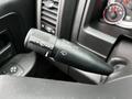 A close-up of the windshield wiper control lever in a 2022 RAM 1500 Classic featuring icons for mist and wiper settings