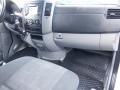 Interior of a 2016 Mercedes-Benz Sprinter showing the dashboard controls and a driver's seat with grey fabric upholstery