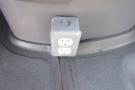 A power outlet mounted on the side wall of a 2012 Mercedes-Benz Sprinter interior