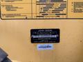 A yellow panel displaying information about a 2011 John Deere 310SJ 4x4 Wheel Loader Extended Hoe 4 in 1 with identification numbers and operating instructions
