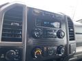 The dashboard of a 2017 Ford F-250 SD featuring audio controls climate settings and digital display for radio and time