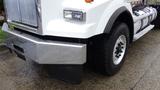 Close-up of a white 2019 Western Star Trucks 4900 SA featuring a shiny chrome front bumper and rugged black tires