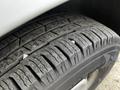 Close-up of a tire from a 2016 Mercedes-Benz Sprinter showcasing its tread pattern and texture