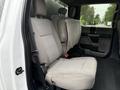 Interior view of a 2020 Ford F-550 showing the rear bench seat with gray fabric upholstery and seat belts